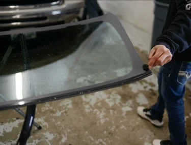 Car windshield being replaced.
