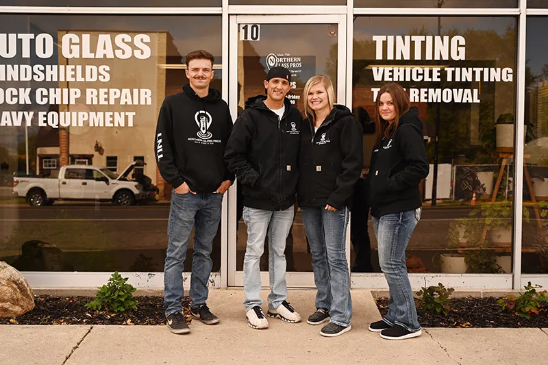 Northern Glass Pros team standing in front of the shop.