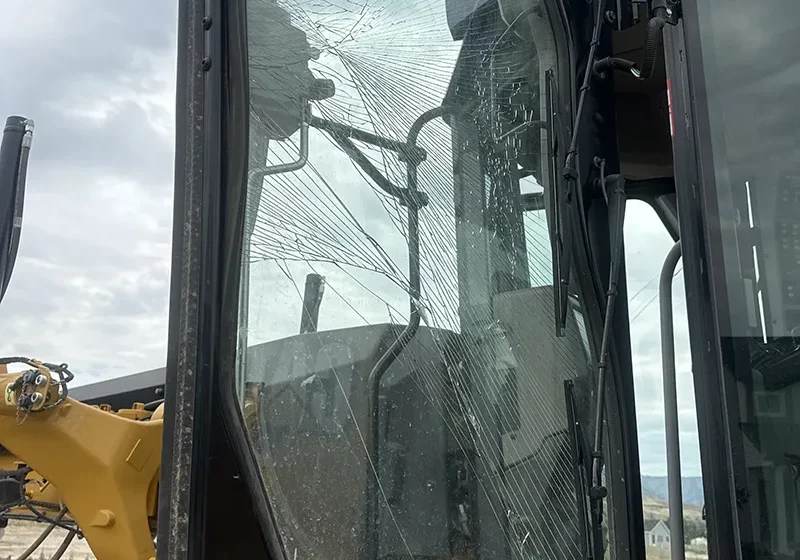 Shattered tractor window.